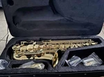 Selmer Model AS711 'prelude' Alto Saxophone With Hard Case And Accessories Open. Price: $950.00.