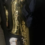 Mendini Alto Saxophone Gold Brass Lacquered With Case & Music Pocketbook Open. Price: $180.00.